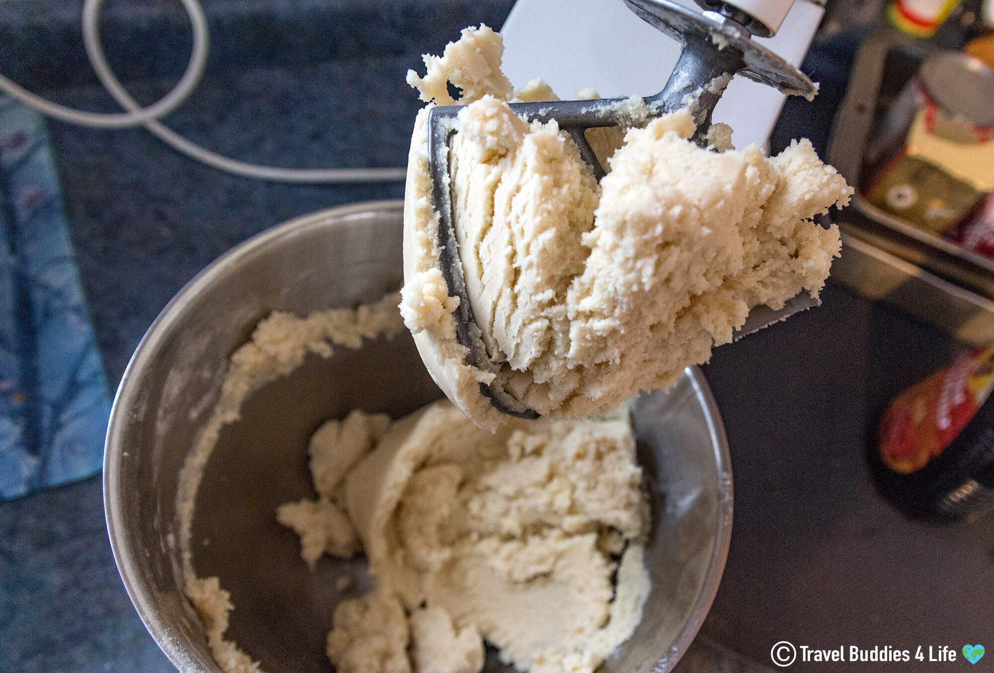 A Mixing Bowl Filled With Christmas Cookie Dough To Make Sand Dollar Cookies