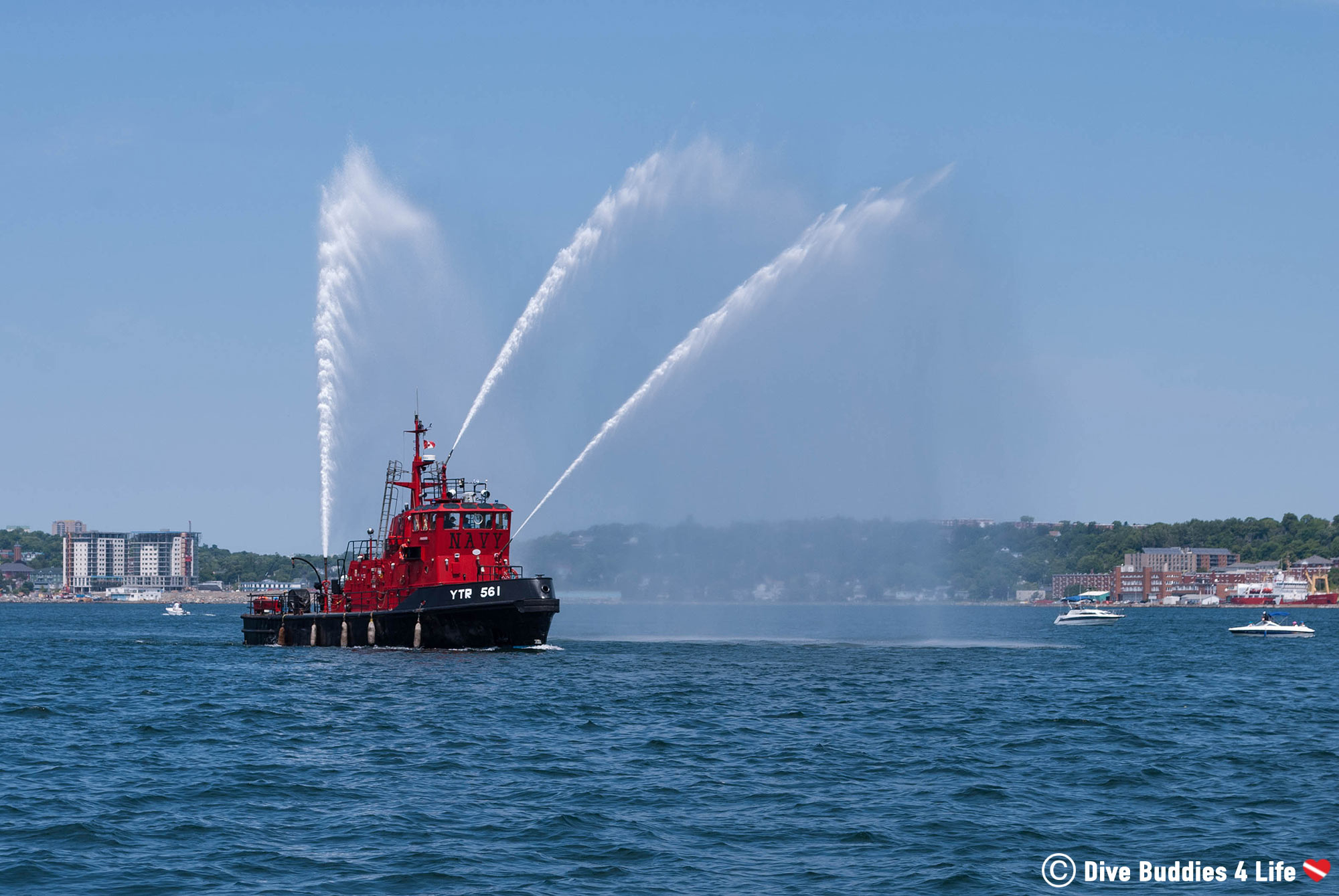 A Navy Boat Spraying Water Across The Halifax Harbour, Canada