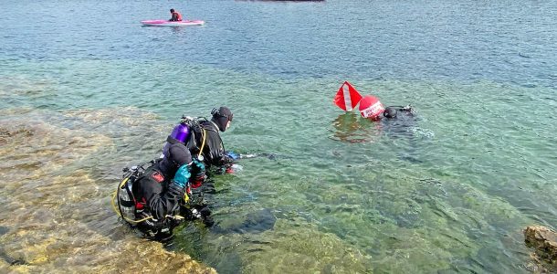 A Trio Of Scuba Divers Heading Into The Water Of Lake Huron For An Underwater Adventure, Scuba Diving Canada