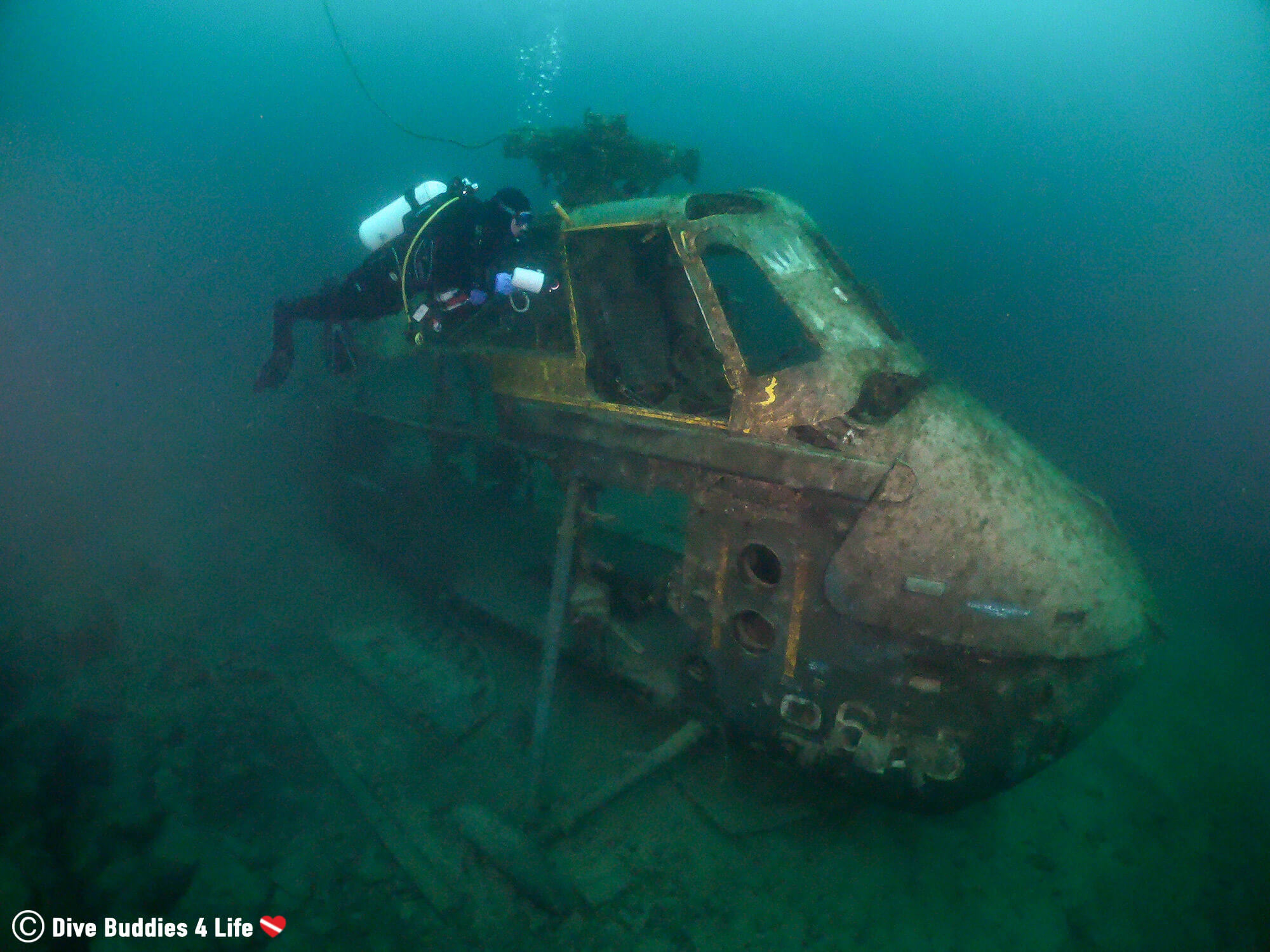 Ali Scuba Diving Around A Sunken Helicopter In The Chepstow Quarry, Wales, UK