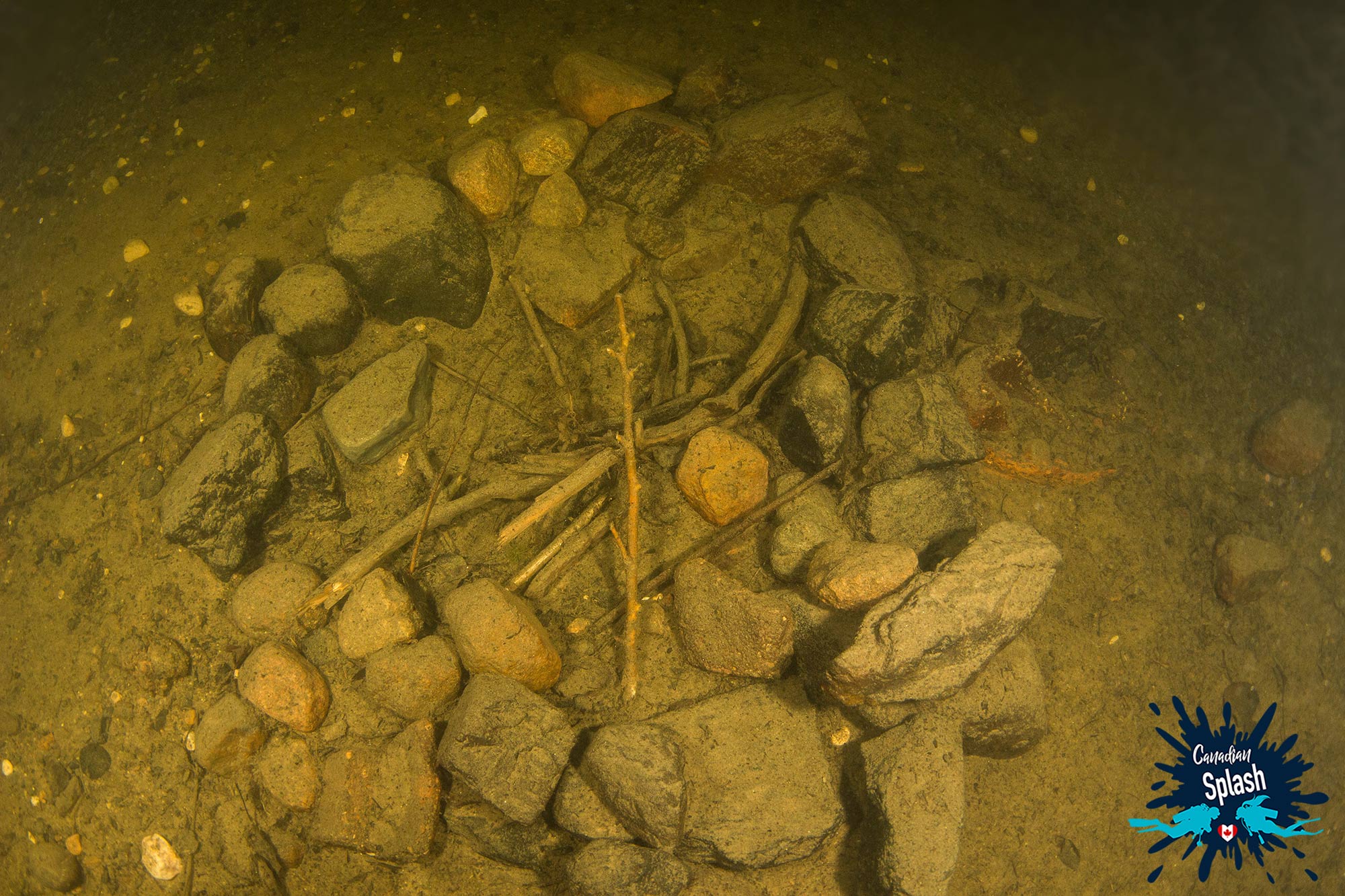 An Underwater Camp Fire On The Bottom Of A Crater Formed Lake, Manitoba's West Hawk, Canada Scuba Diving