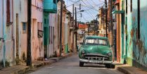 Cuban Streets with a Green Old Fashioned Car