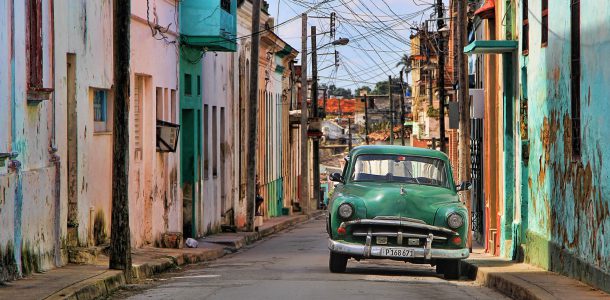 Cuban Streets with a Green Old Fashioned Car