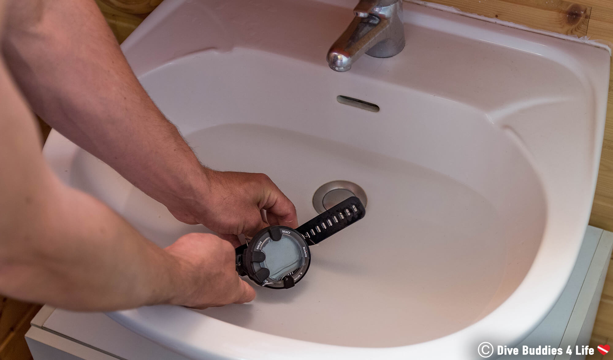 Joey Cleaning His Dive Watch After Going Scuba Diving In New Brunswick, Nova Scotia