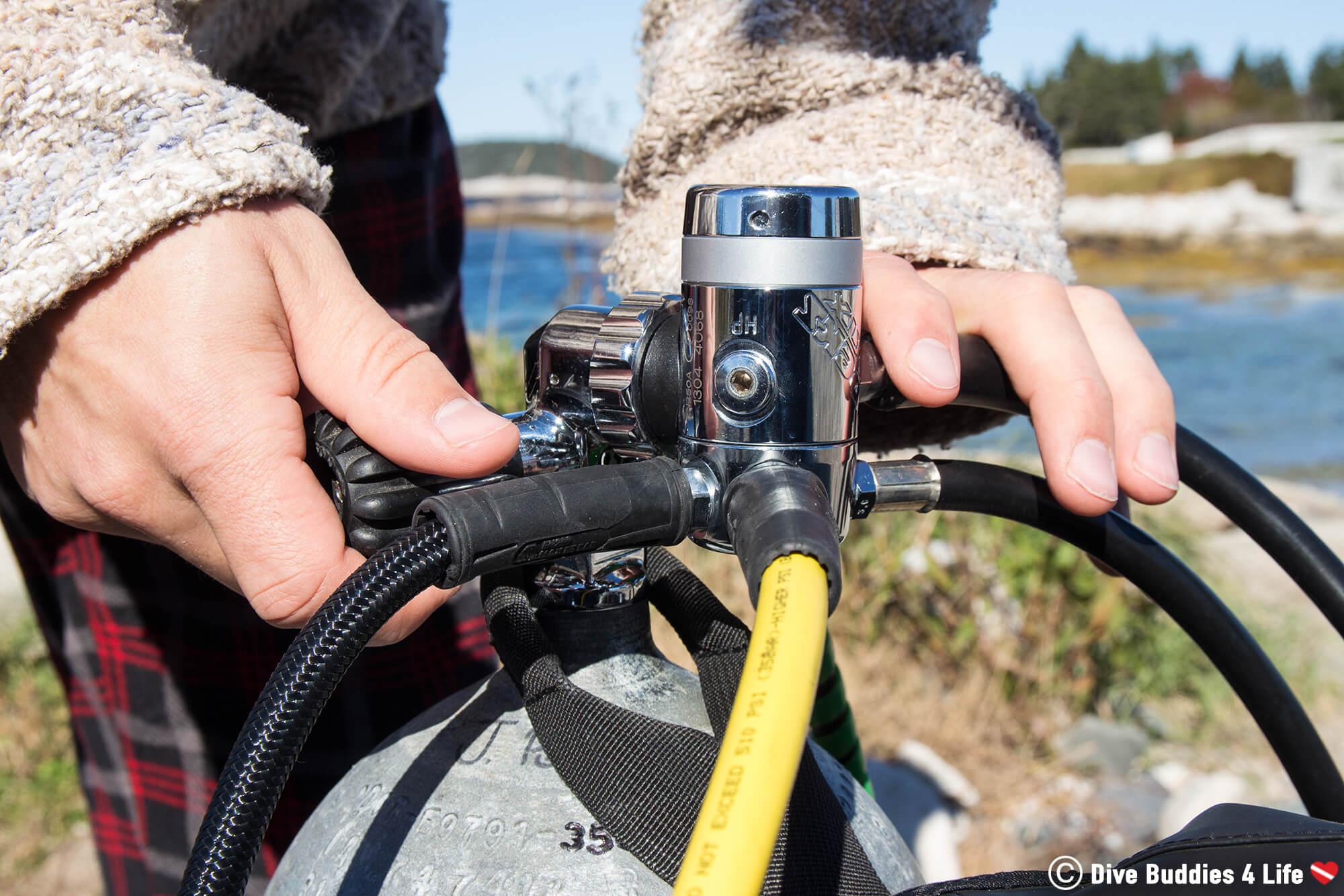 Joey Setting Up His Regulator And Tank For A Scuba Dive In New Brunswick, Canada