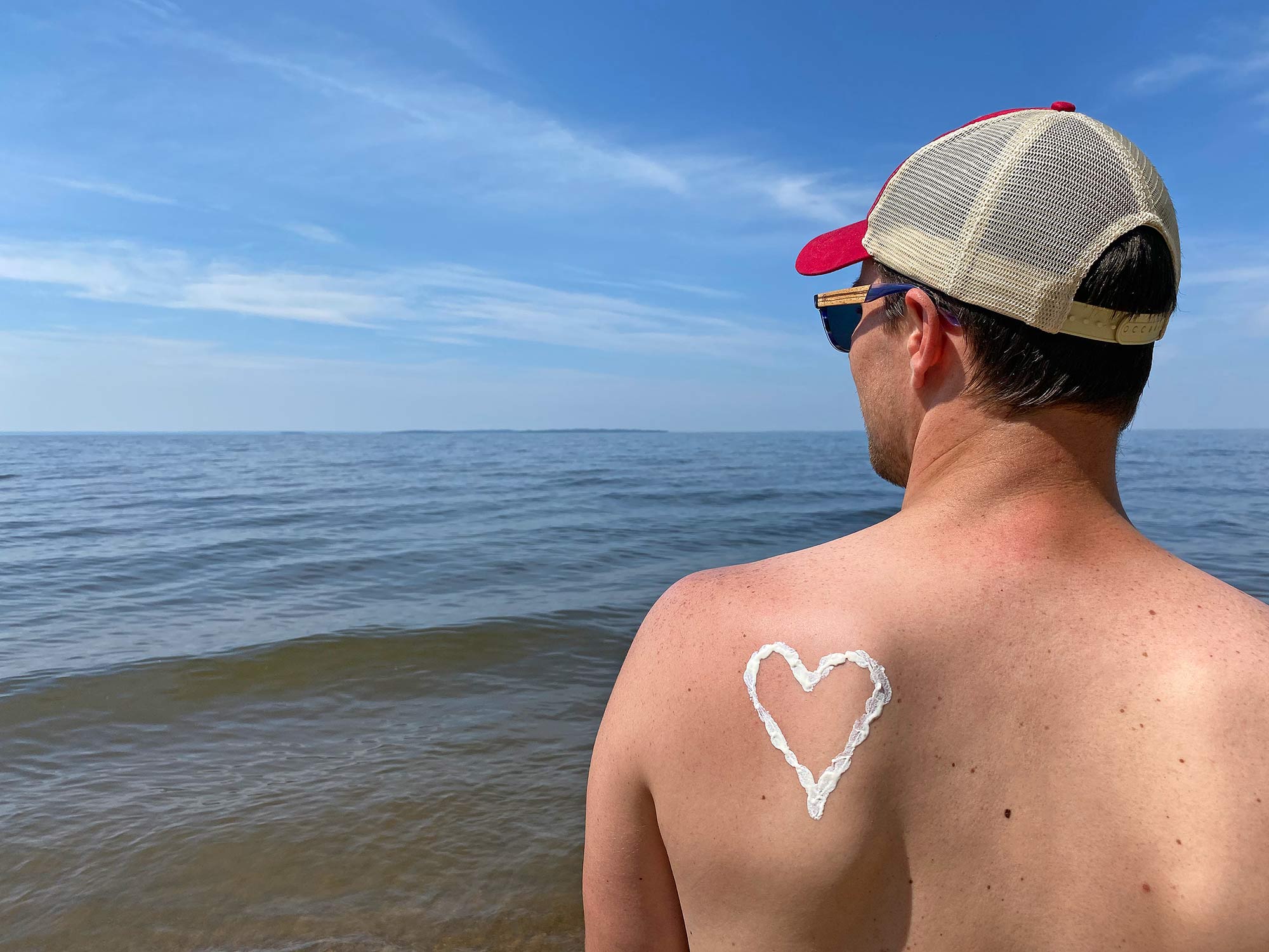 Joey Using Reef Safe Sunscreen While Hitting The Beaches In Northern Ontario, Canada