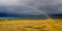 A Rainbow Over a Field near the Trolls in Iceland, Europe
