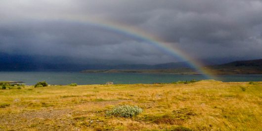 A Rainbow Over a Field near the Trolls in Iceland, Europe