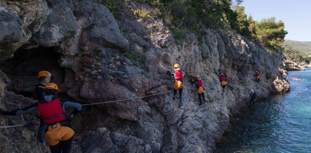 Several Coasteering People Along The Coast With WIND In Portugal